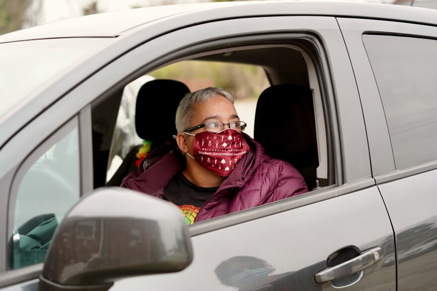 Melissa Hibbs speaks with St. Matthews Area Ministries' executive director Julie Abbott about what she'll receive from the food pantry on Dec. 8, 2020.