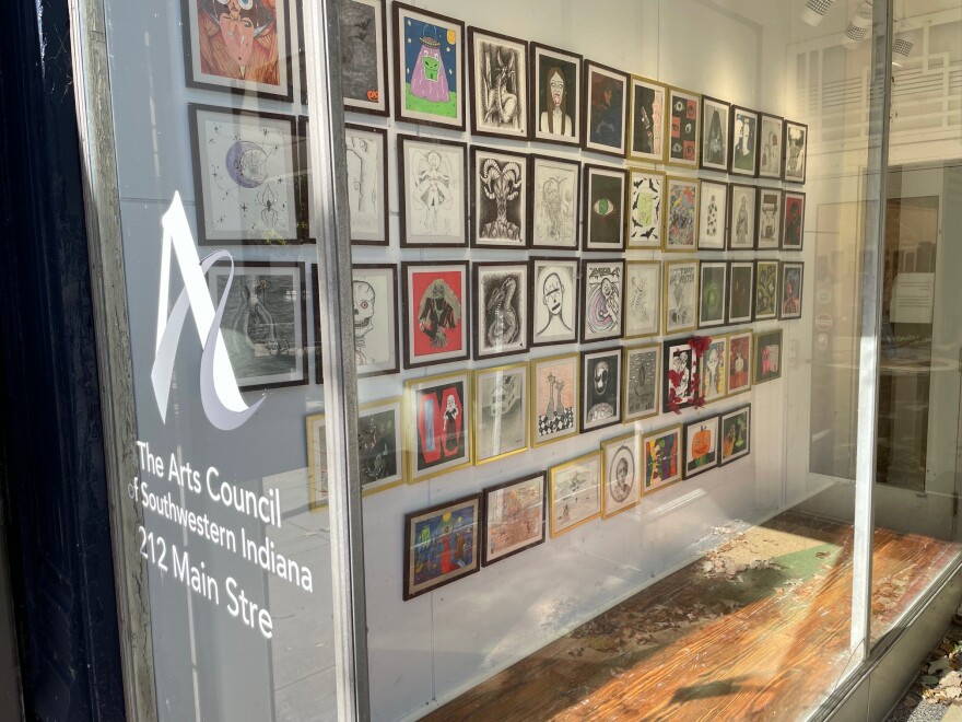 The front window of the Arts Council Gallery on Main St. in Evansville, IN