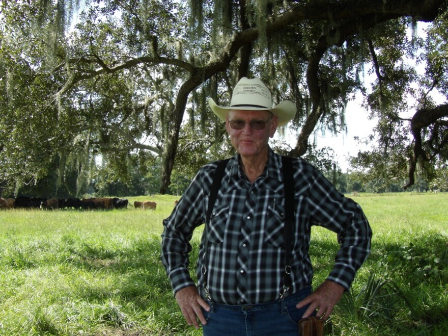 Newt Keen poses for a photo on his cattle ranch in DeSoto County.