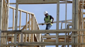 A construction worker at an apartment and retail complex in Nashville. The U.S. economy grew at a less-than-expected 2.6 percent pace in the fourth quarter.