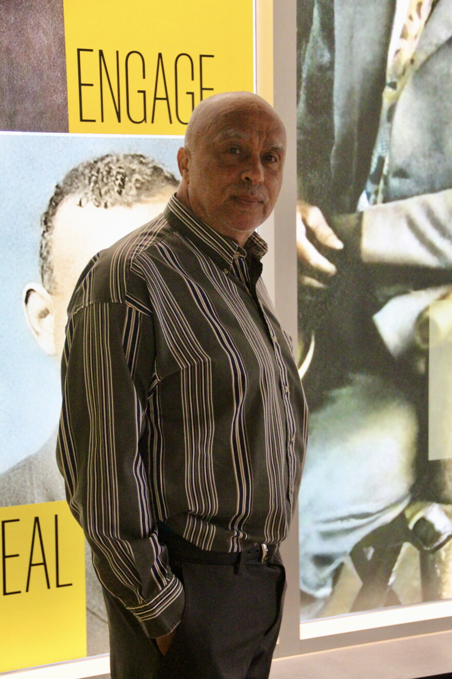 Jim Crow Museum Founder and Director Dr. David Pilgrim poses in front of one of the displays at the new location of the museum