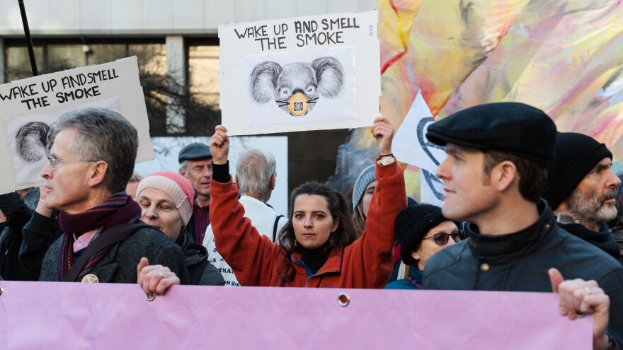 Activists protest outside the Australian Embassy in London, accusing Australia's government of inadequately responding to the fires and an overall climate emergency.