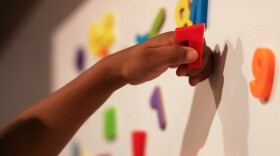 Children learn through play with magnetic letters and numbers at Fun Times With Titi Childcare on Monday, October 27, 2025.
