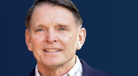Ed Gallrein in a plaid button-down shirt and navy blazer.
