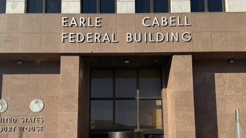 A building with the words "Earle Cabell Federal Building."