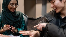 A student tries Mehndi at the WMU International Festival