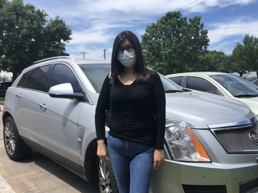 Erica Campos says she initially felt ashamed driving up to the food bank in her used Cadillac, but "there's no shame in feeding my children."