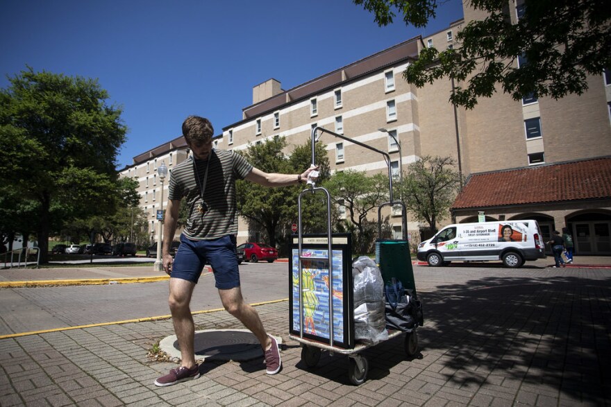 UT freshman Andrew Dareing moves his belongings out of the Jester-West dorm after campus shut down to help prevent the spread of the coronavirus. 