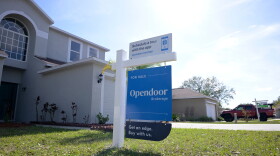FILE - Real estate signs are posted outside homes for sale, Feb. 21, 2023, in Valrico, Fla.