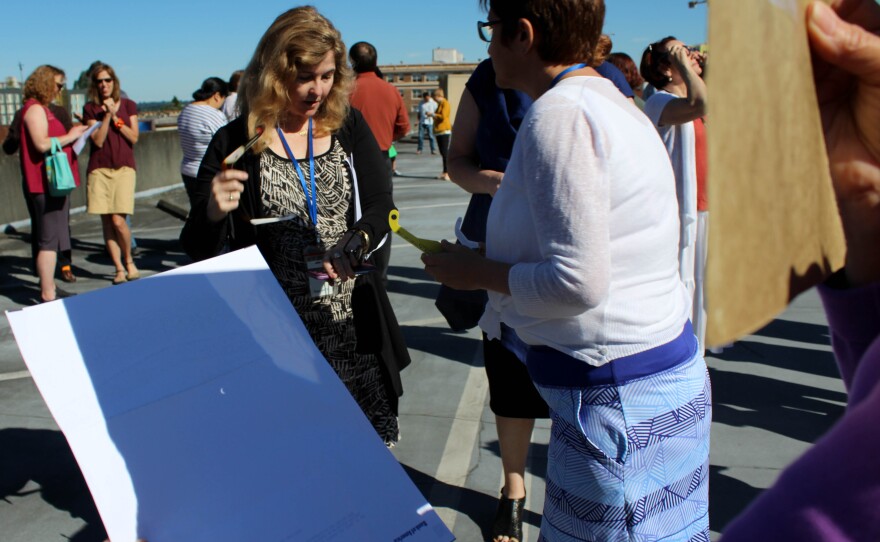 KUOW producer Katherine Banwell watched the eclipse through a pinhole on the roof of the parking garage.