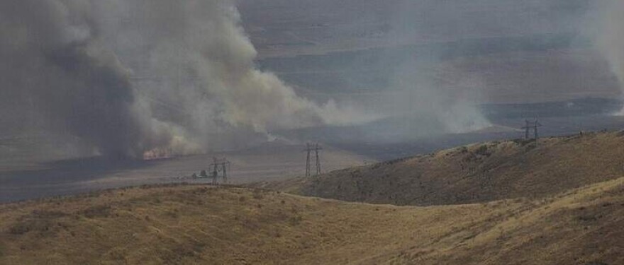 A wildfire burned more than 500 acres of land and forced some evacuations in eastern San Luis Obispo County Tuesday.