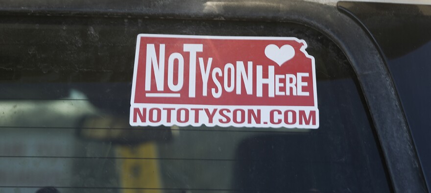 A window sticker reading No Tyson Here nototyson.com