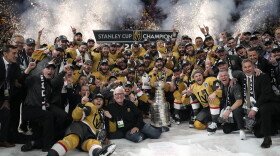 Members of the Vegas Golden Knights pose with the Stanley Cup after the Knights defeated the Florida Panthers 9-3 in Game 5 of the NHL hockey Stanley Cup Finals Tuesday, June 13, 2023, in Las Vegas. The Knights won the series 4-1. (AP Photo/John Locher)