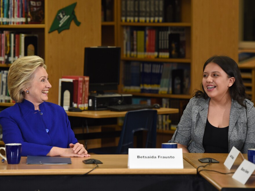 Democratic presidential candidate and former U.S. Secretary of State Hillary Clinton speaks with student Betsaida Frausto on May 5 at Rancho High School in Las Vegas. Clinton said that any immigration reform would need to include a path to "full and equal citizenship."