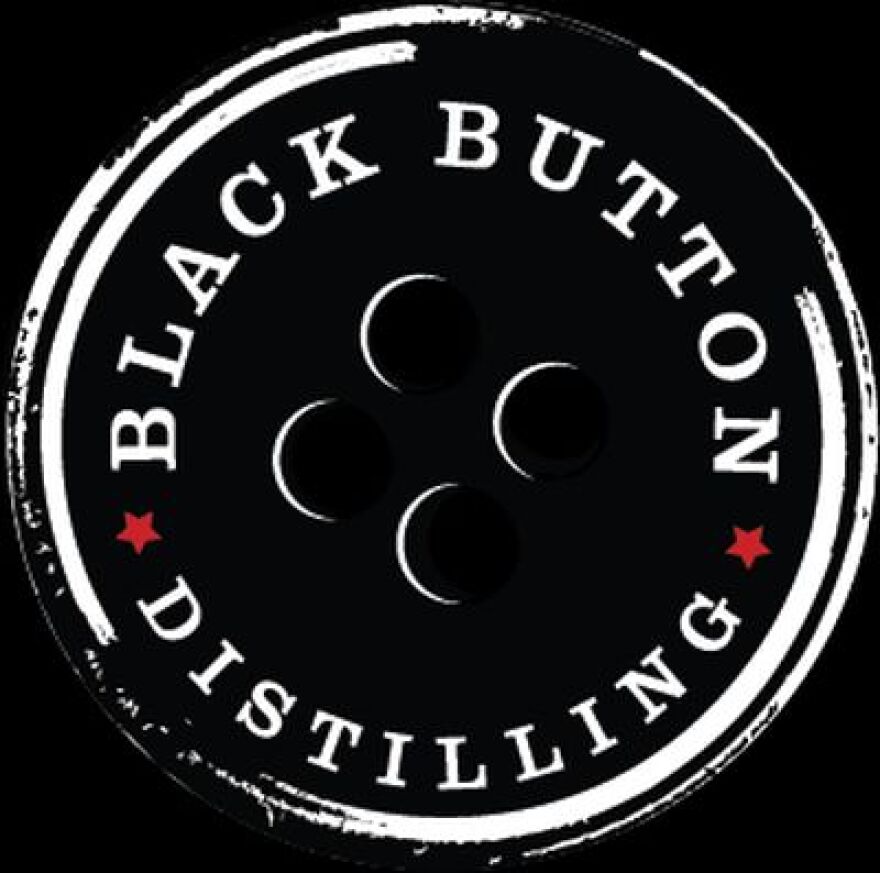 Black Button Distilling logo with a black button and red stars