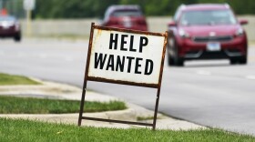 FILE - In this Tuesday, July 27, 2021, file photo, a help-wanted sign is displayed at a gas station in Mount Prospect, Ill. (AP Photo/Nam Y. Huh, File)