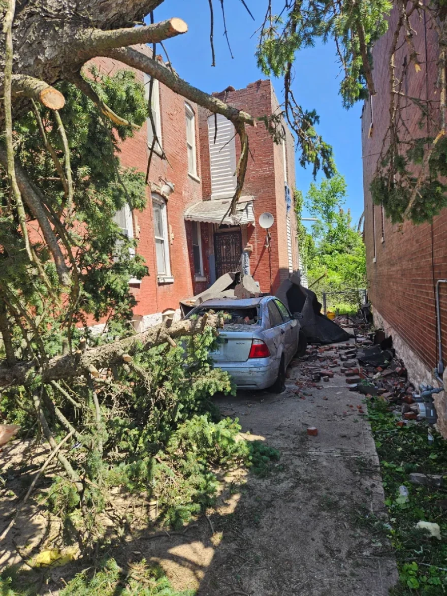 Debris from the tornado destroyed homes and cars.