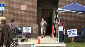 Early voters come and go Monday at the Regency Branch of the Jacksonville Public Library.