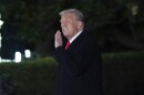 President Donald Trump arrives on the South Lawn of the White House, in Washington, Monday, Feb. 10, 2025.