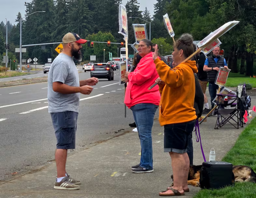 An undated, provided photo of Brett Smith, a third-party candidate on the ballot in the Oregon governor’s race, talking with picketers. Smith is running under the Pacific Green Party of Oregon.