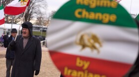 Former Iranian Olympic wrestler Moslem Eskandar-Filabi rallies with Supporters of the National Council of Resistance of Iran outside the White House for regime change in Iran, Wednesday, Dec. 31, 2025, in Washington. (AP Photo/Evan Vucci)