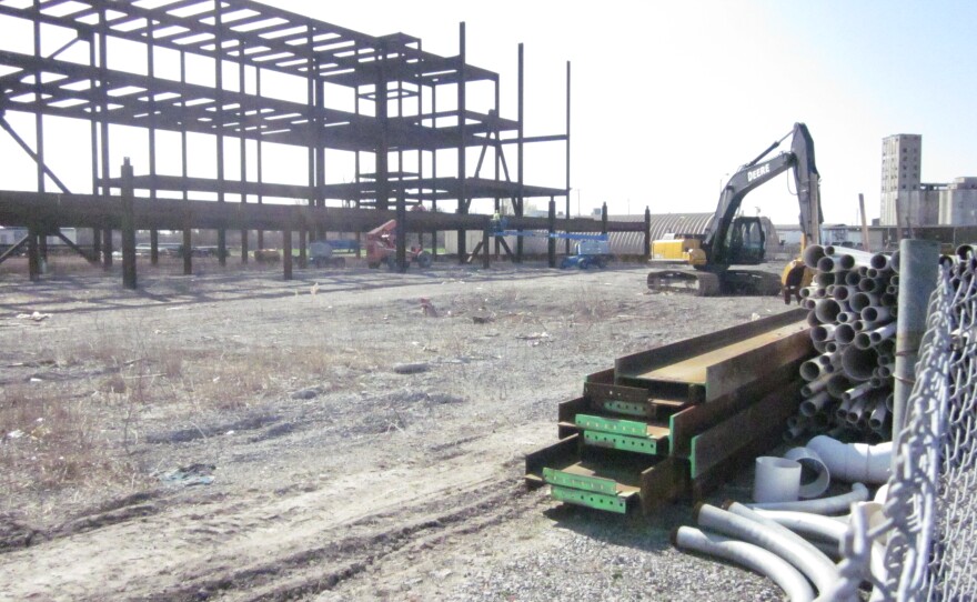 The rusting frame of the originally-planned larger facility will come down in the next several weeks