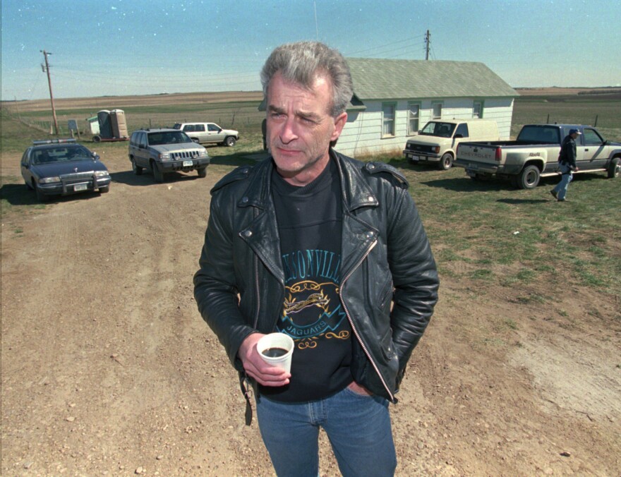 FILE - Randy Weaver, the object of the Ruby Ridge siege, visits with the media at the main FBI roadblock outside the Freemen compound in Montana on April 27, 1996. Weaver, patriarch of a family that were involved in an 11-day Idaho standoff in 1992 with federal agents that left three people dead and served as a spark for the growth of anti-government extremists, has died at the age of 74. His death was announced Thursday, May 12, 2022, in a Facebook post by daughter Sara Weaver, who lives near Kalispell, Montana. (AP Photo/Jim Mone, File)