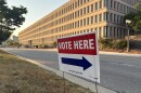 Vote here sign sits outside of a Lansing polling location.