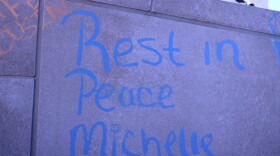 A tribute to Michelle Woolford chalked on a wall outside the Broome County government building along Halsey Street in Binghamton. Woolford died in her first floor room at the Knights Inn in Endwell.
