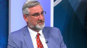 Gov. Eric Holcomb speaks at a White House event with President Joe Biden to promote passage of legislation to manufacture semiconductors in the United States.