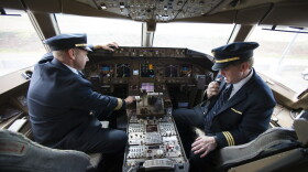 United Airlines Capt. Tommy Holloman, left, and Capt. Chuck Stewart in the cockpit of a United Airlines Boeing 777 at Dulles International Airport Air Traffic Control Tower in Sterling, Va., Tuesday, Sept. 27, 2016. (Cliff Owen/AP)
