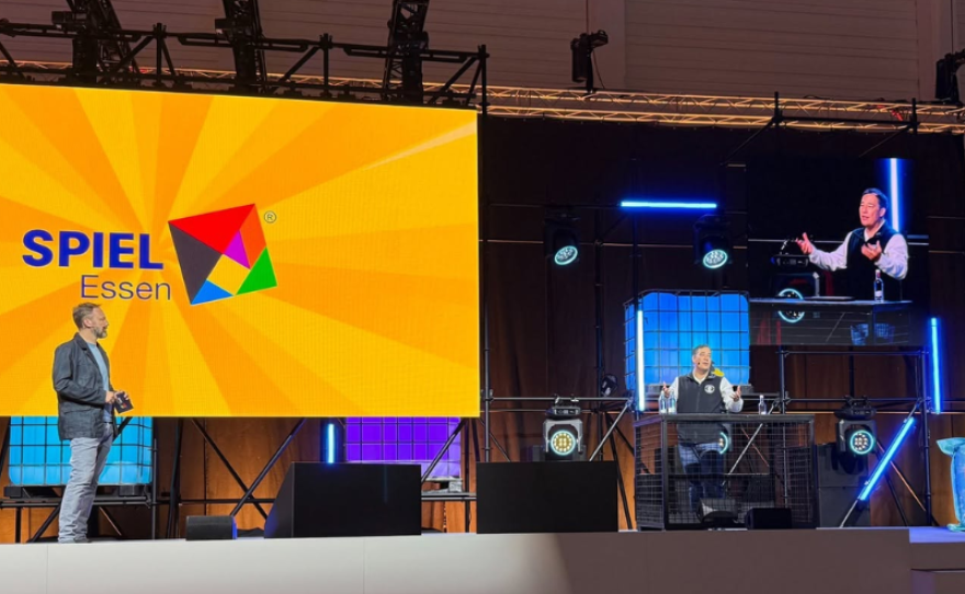 Washington Secretary of State Steve Hobbs presents at SPIEL Essen 2025 in Germany, the world's largest tabletop gaming convention. Hobbs led a trade mission to the convention, taking a collection of Washington-based game creators, publishers, and other related tabletop businesses.