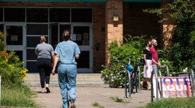 Voters walk into Zilker Elementary in Austin during the primary runoff elections on July 14.