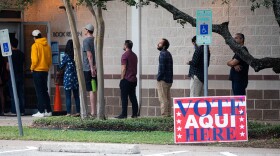 Voters waiting in line about to enter the door at Milwood Branch to vote on Election day on Nov. 8, 2022. Patricia Lim/KUT