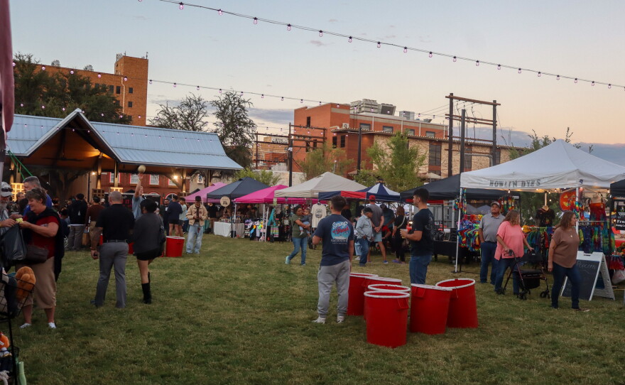 Participants play yard games as vendors sell their products, photo by Emma Coats.