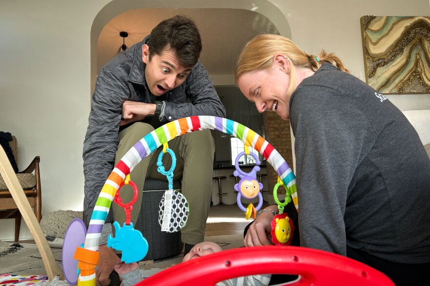 Scott Houck and Callie Silver play with their son, Wesley, at their home in Salt Lake City, Dec. 10, 2025. Houck and Silver currently rely on family for part of their child care and are looking into full-time day care options in the future.