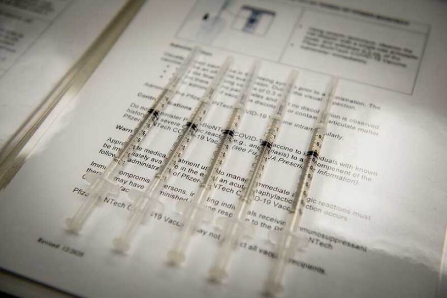 Prepared doses of COVID-19 vaccine are lined up, ready to be distributed. 