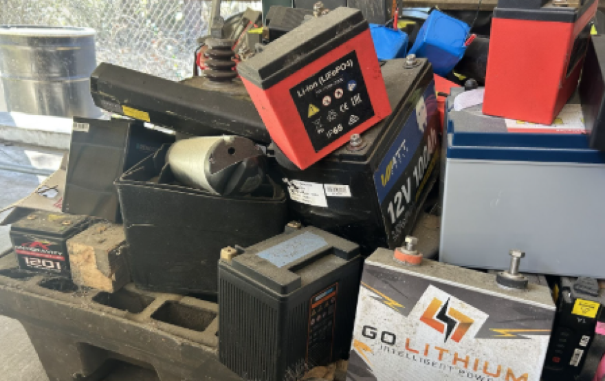 A pile of batteries at Alachua County’s Leveda Brown Environmental Park & Transfer Station. Lithium-ion batteries must be handled carefully to avoid fire risk. (Natalie Kaufman/WUFT)