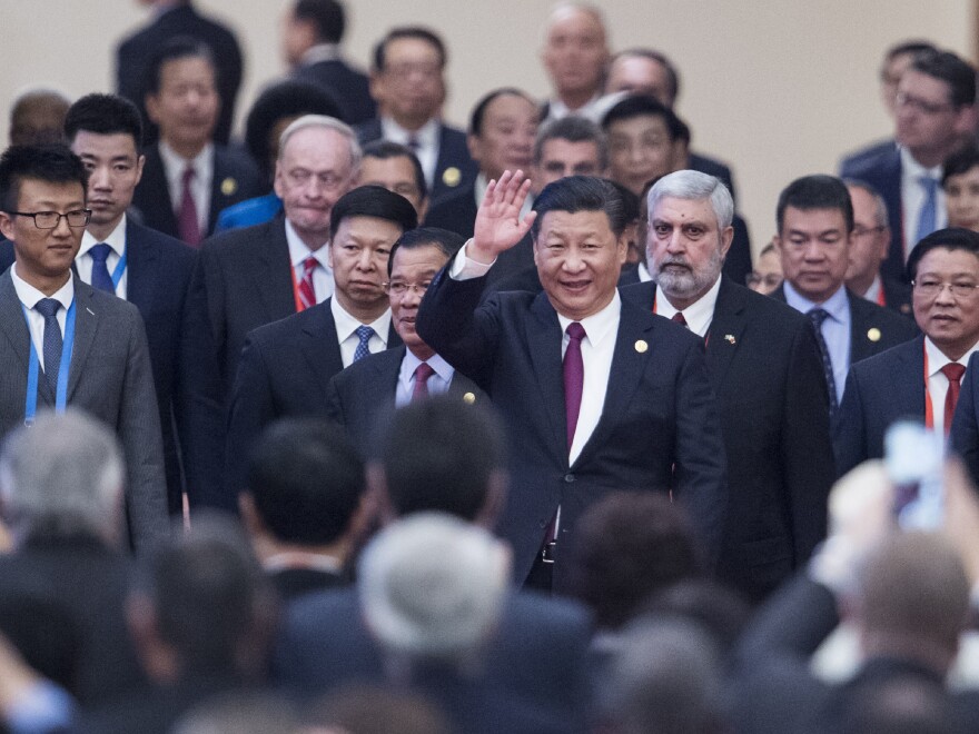 China's President Xi Jinping arrives with visiting leaders at a meeting held by the Communist Party of China in Beijing Dec. 1.