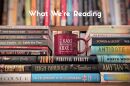 books and a mug with KAXE on it. Text reads "What We're Reading"