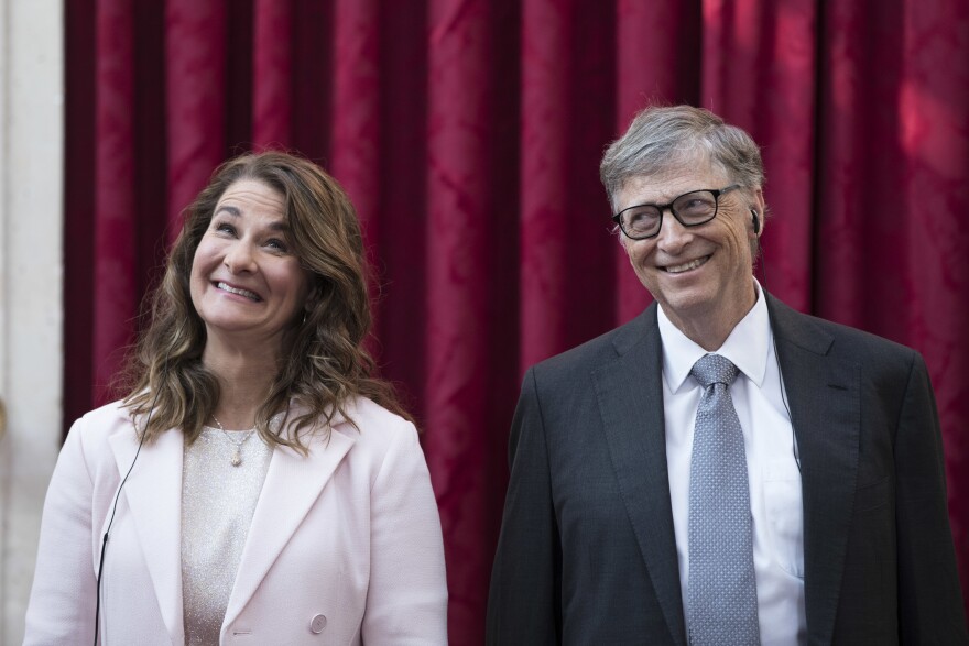 Melinda French Gates and Bill Gates react prior to being awarded the Legion of Honour at the Elysee Palace in Paris on April 21, 2017. They announced plans to divorce earlier this year but will continue to work together as co-chairs of their foundation.