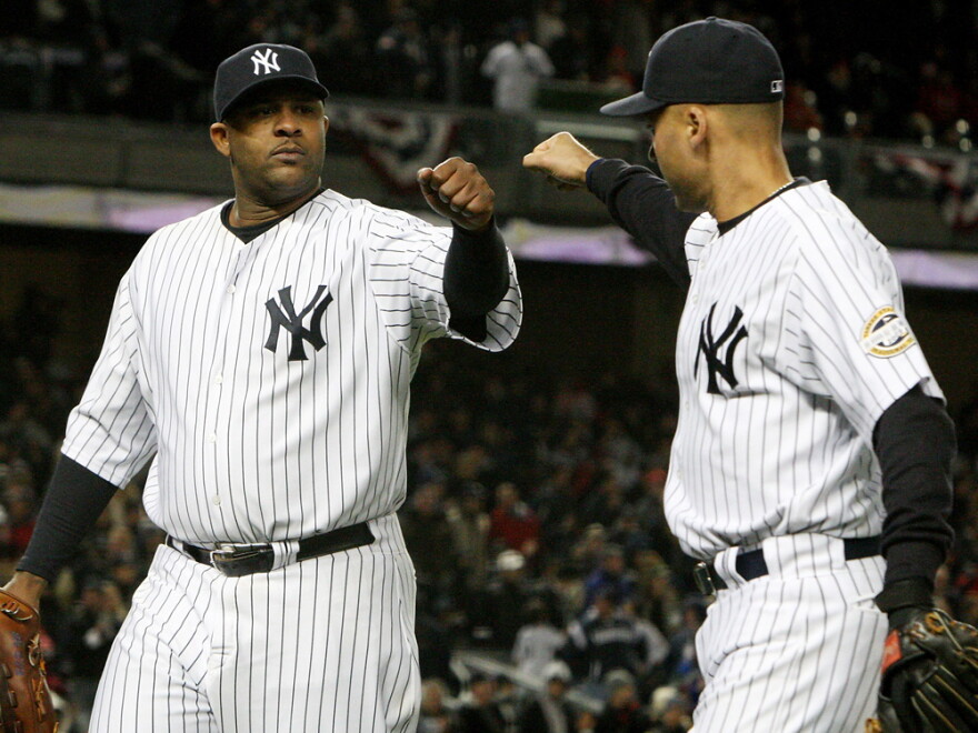 The New York Yankees' deep pockets allow them to keep stars like Derek Jeter (right), even as the club adds free agents like pitcher CC Sabathia, a key component on last year's championship team.