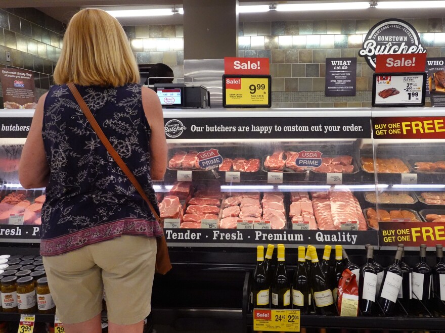 A customer shops for meat at a supermarket in Chicago on June 10. A surge in meat prices is contributing to higher inflation, raising the Biden administration's concern.