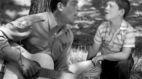 Andy Griffith as Sheriff Andy Taylor and Ron Howard as his son, "Opie" Taylor sing together in 1962.
