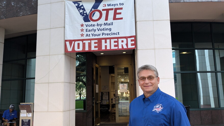 Leon County Elections Supervisor Mark Earley stands before the Leon County Courthouse early voting site.