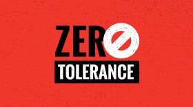 A sign reads "ZERO TOLERANCE"