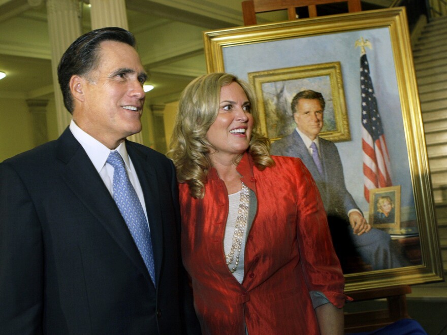 Former Massachusetts Gov. Mitt Romney and his wife, Ann, greet guests after his official portrait is unveiled in 2009 during a ceremony on the Grand Staircase at the Statehouse in Boston.