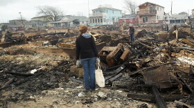 People look through the remains of homes destroyed during Hurricane Sandy October 30, 2012 in the Breezy Point neighborhood of the Queens borough of New York City. (Spencer Platt/Getty Images)