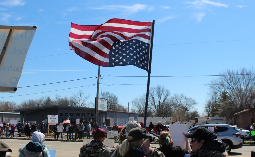Mike Herder, retired electrician, flys an American flag upside down to represent a country in distress.