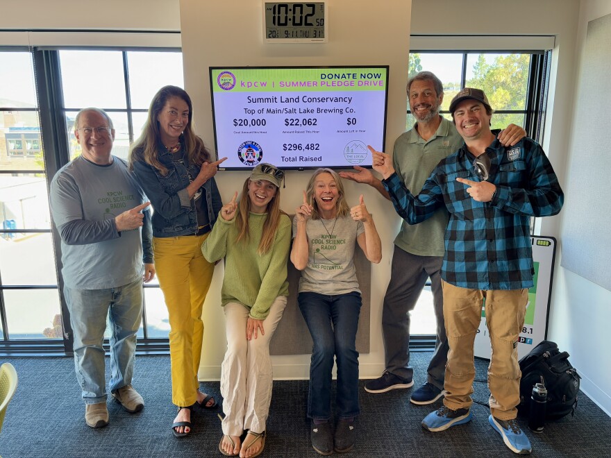 One of KPCW's nonprofit partners & sponsor celebrating a successful pledge drive hour